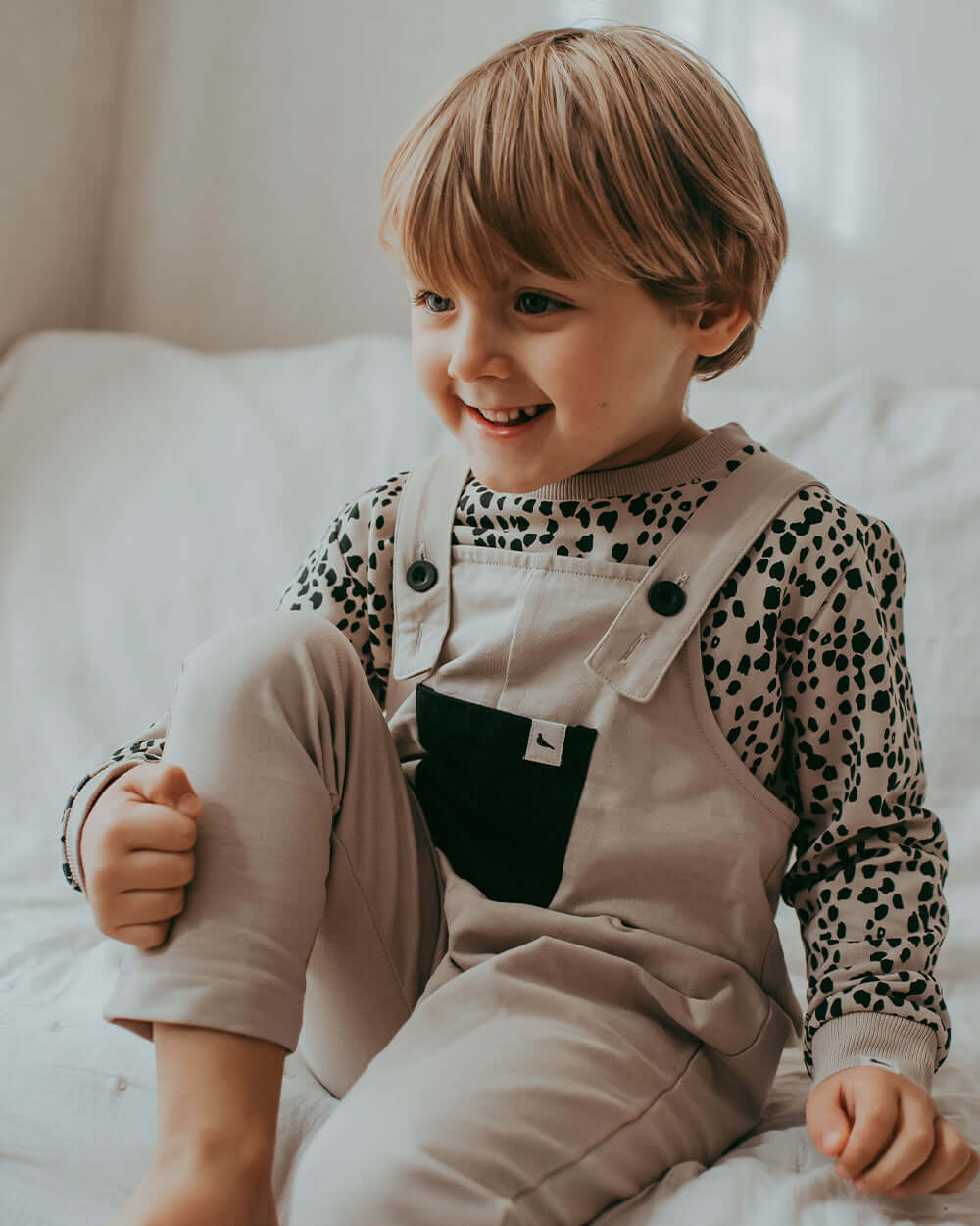 Boy wearing unisex organic cotton kids long-sleeve top