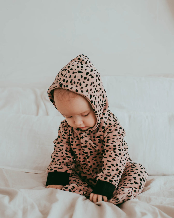 Baby wearing organic cotton animal print baby onesie