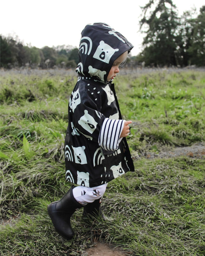 Boy wearing sustainable organic kids raincoat