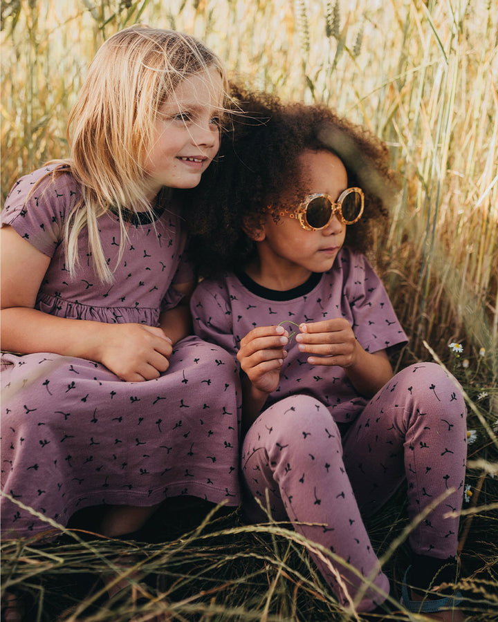 Girl wearing gender-neutral organic cotton kids leggings