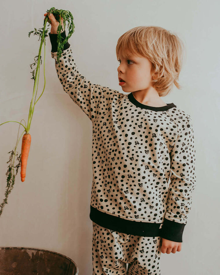 Boy wearing gender-neutral organic cotton kids sweatshirt