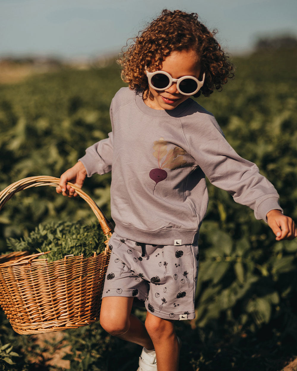 Boy wearing gender-neutral organic cotton kids shorts